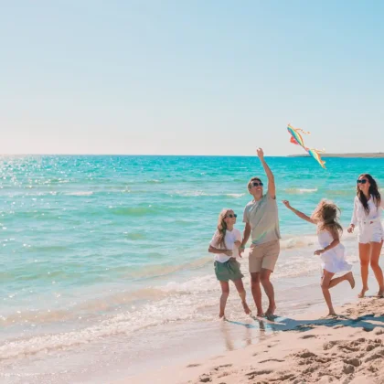 Happy family on a beach during summer vacation